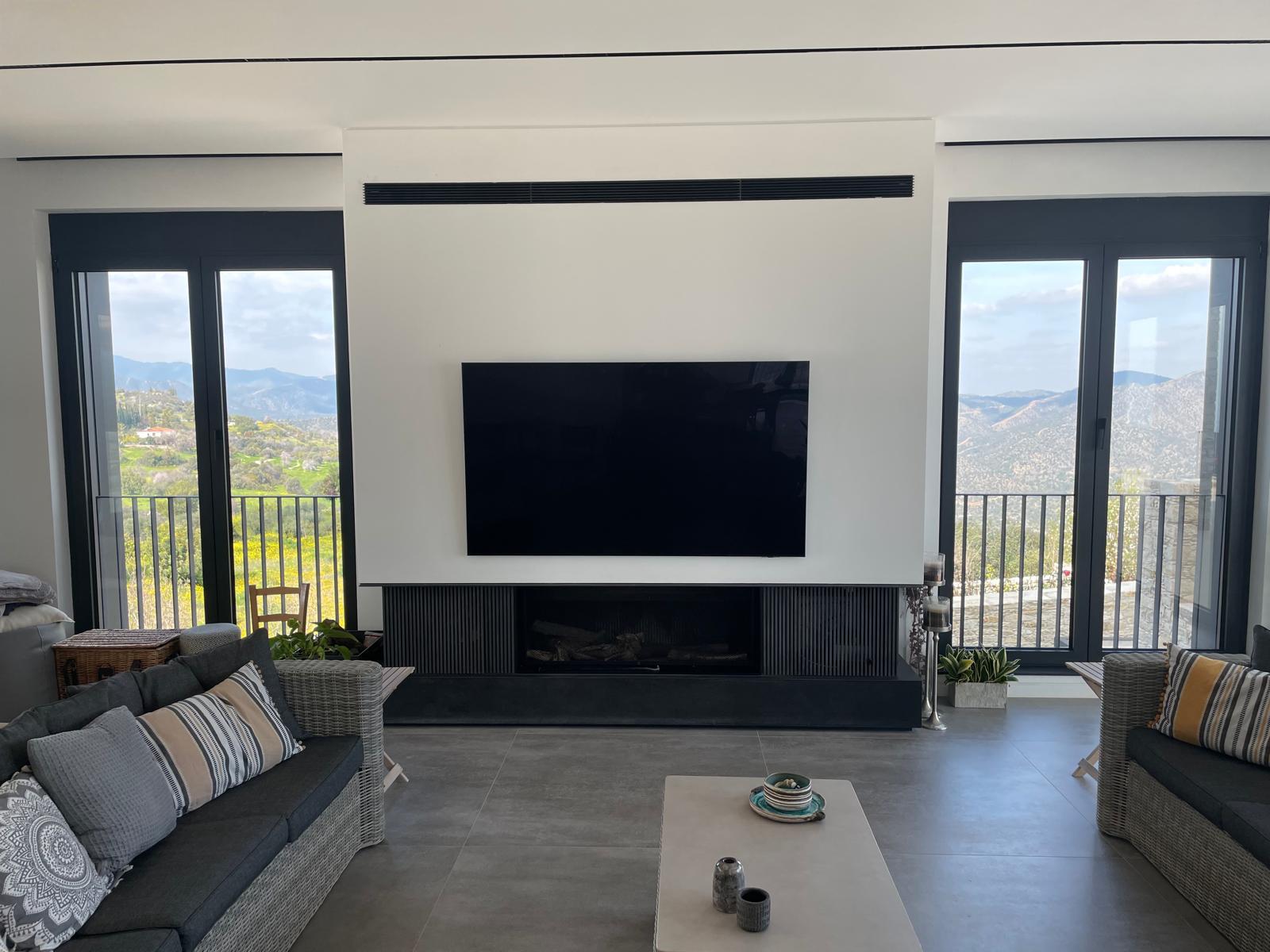 Modern living room interior showcasing C&S Refurb & Constructions quality workmanship with mountain views